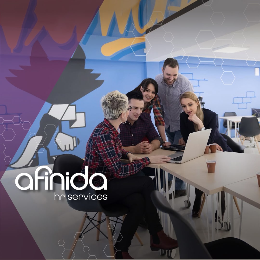 Startup team having a collaborative meeting in a modern office space, discussing growth strategies and HR solutions